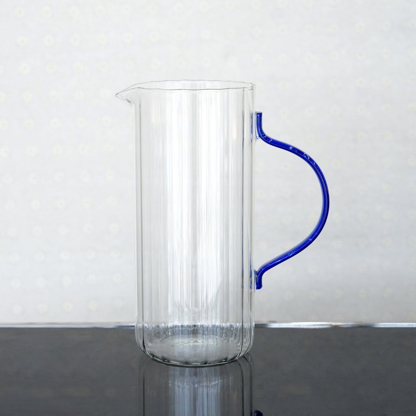 007-18 Glass Water Jug – Elegant Clear Ribbed Glass with Blue Handle Design