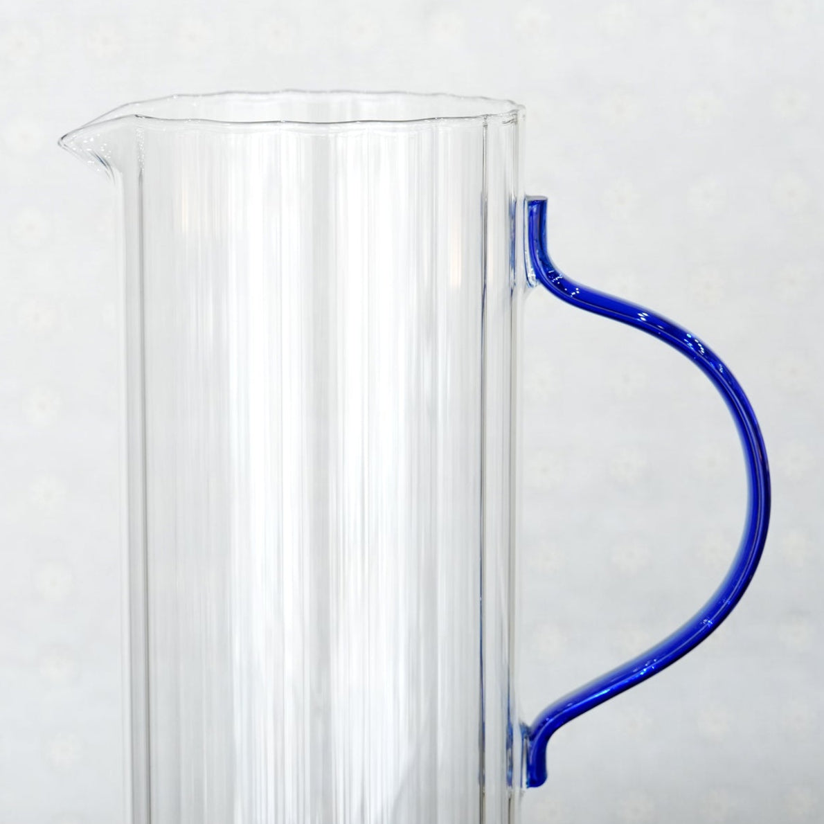 007-18 Glass Water Jug – Elegant Clear Ribbed Glass with Blue Handle Design