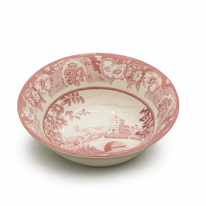 Ceramic bowl with pink floral and landscape design on a white background