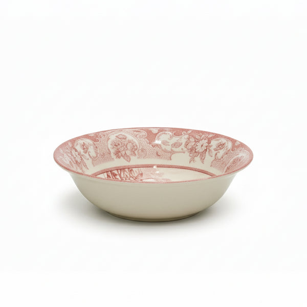 White ceramic bowl with pink floral pattern on a white background