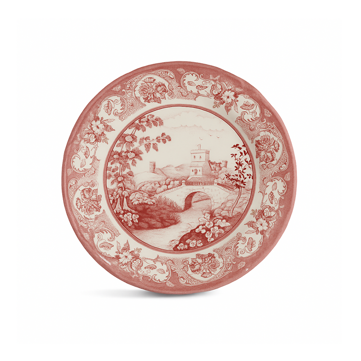 Decorative plate with red floral and landscape design on a white background