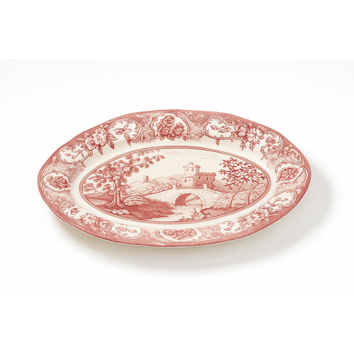 Decorative plate with red and white design on a white background