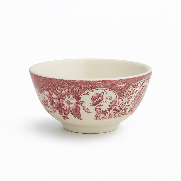 Ceramic bowl with red floral pattern on a white background