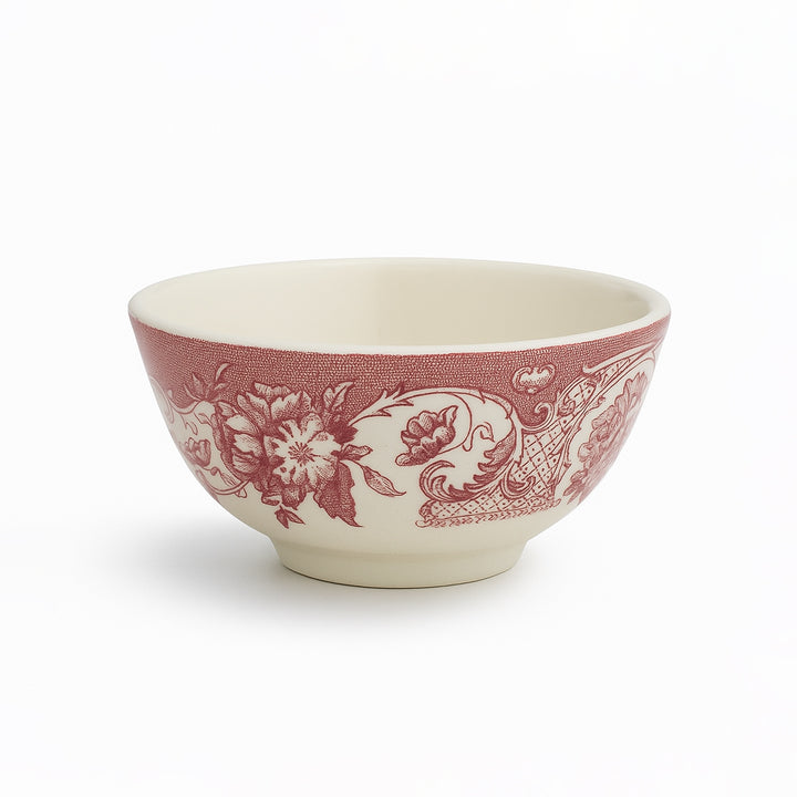 Ceramic bowl with red floral pattern on a white background