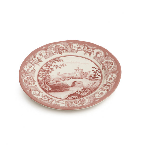 Decorative plate with pink floral and landscape design on a white background