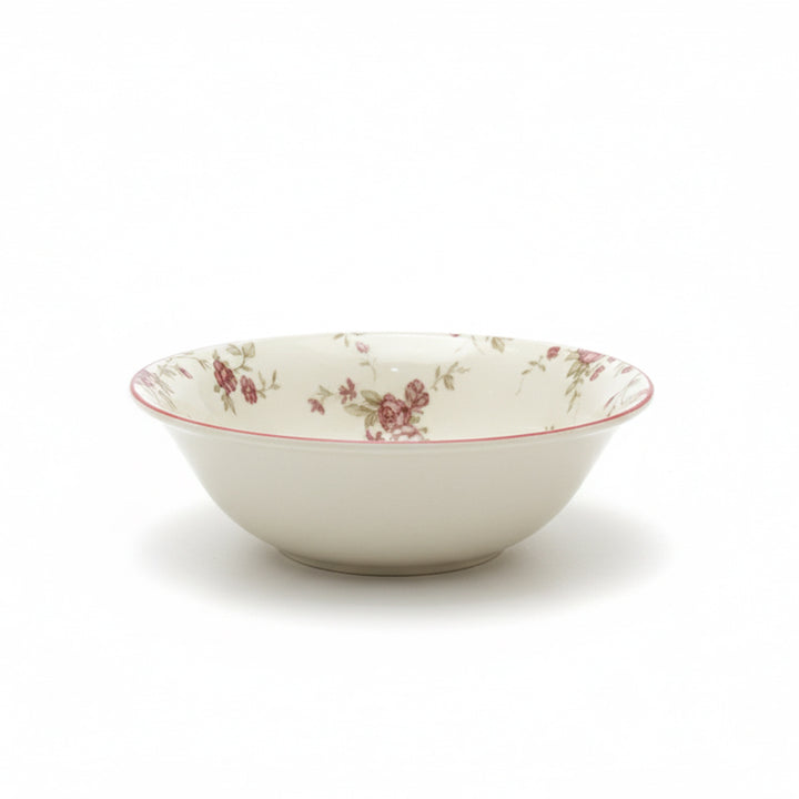 White ceramic bowl with floral pattern on a white background