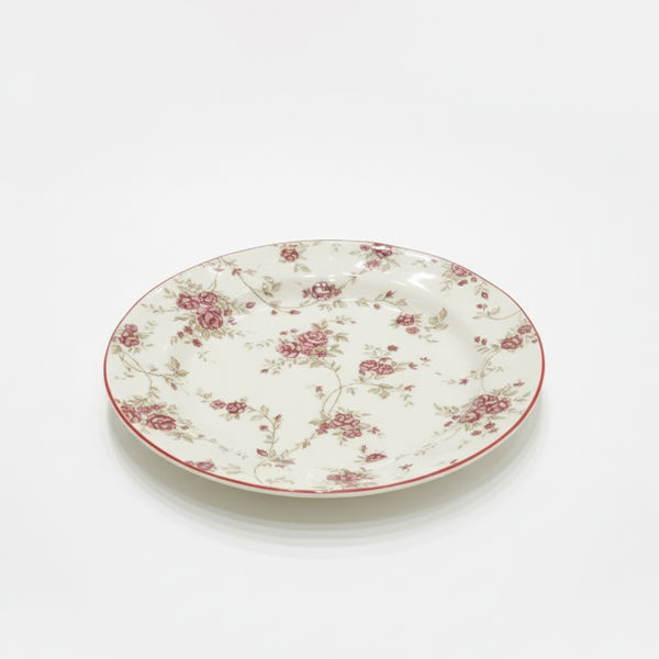 Floral-patterned ceramic plate on a white background