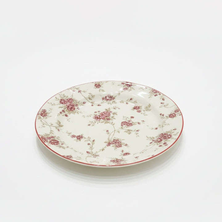 Floral-patterned ceramic plate on a white background