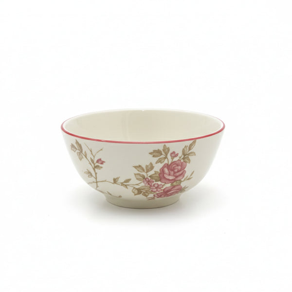 Decorative ceramic bowl with floral patterns on a white background