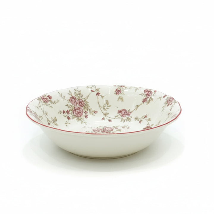 White ceramic bowl with floral pattern on a white background