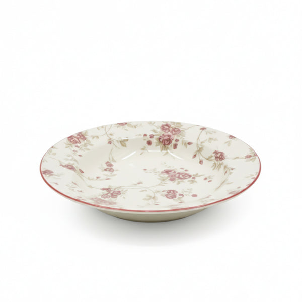 Decorative ceramic bowl with floral pattern on a white background