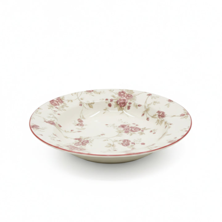 Decorative ceramic bowl with floral pattern on a white background
