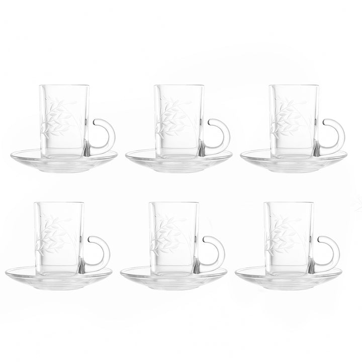 Set of six clear glass coffee cups with handles and saucers on a white background