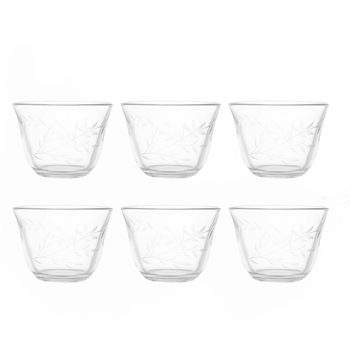 Set of six clear glass bowls on a white background