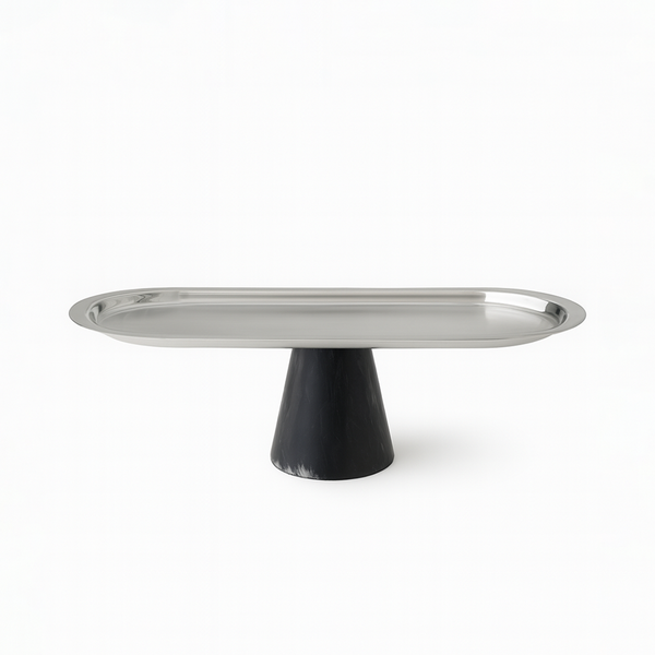 Metallic cake stand with black base on a white background