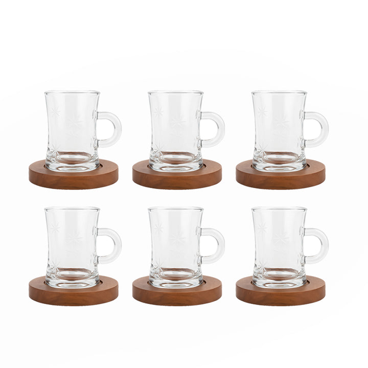 Set of six clear glass mugs with wooden coasters on a white background