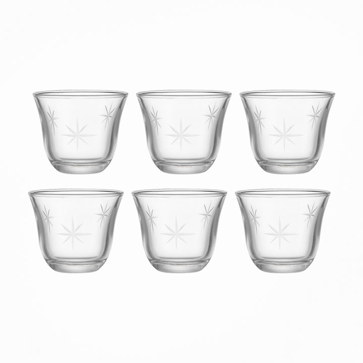 Set of six clear glass cups with star patterns on a white background