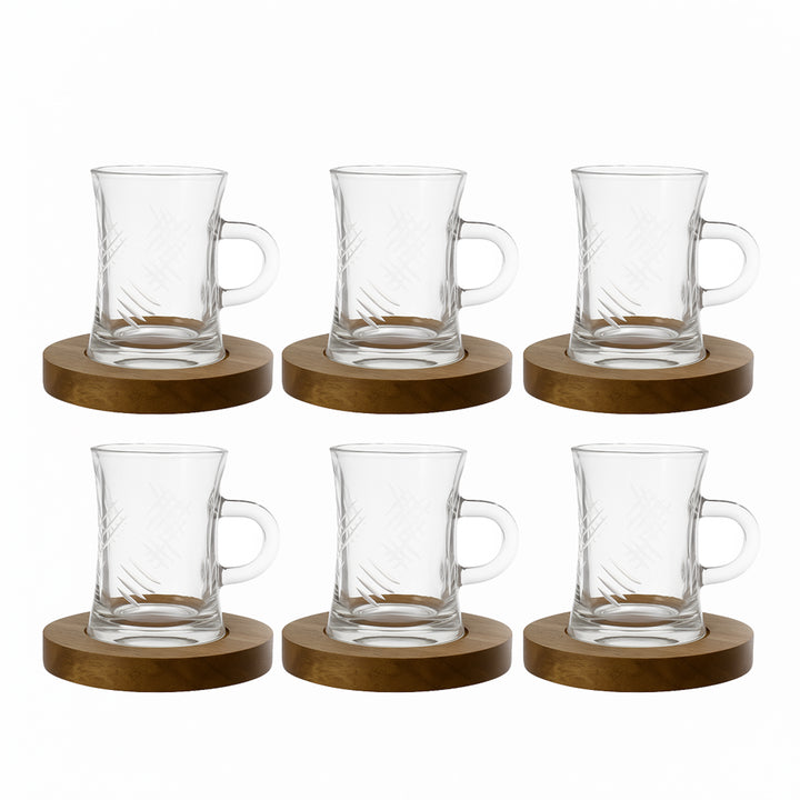 Set of six clear glass mugs with wooden coasters on a white background