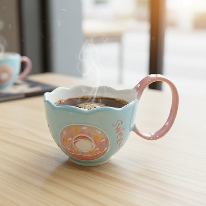 Ceramic mug with a donut design on a wooden surface