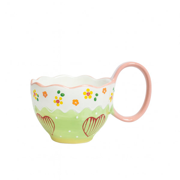 Ceramic cup with a green and white floral pattern, scalloped rim, red heart accents, and pink handle — displayed on a white background from Siddiq Gifts, Mussafah Abu Dhabi.