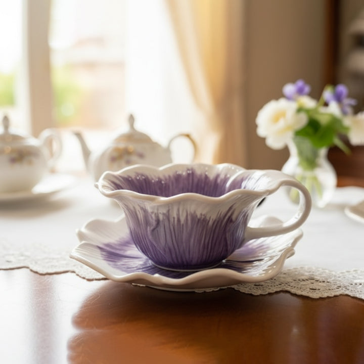 Purple teacup and saucer on a lace tablecloth with a blurred background