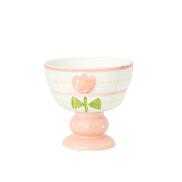 Decorative ceramic bowl with a pink base and white top featuring floral designs on a white background.