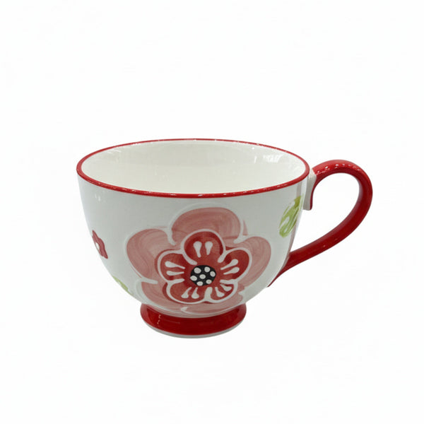 Ceramic mug with floral design on a white background