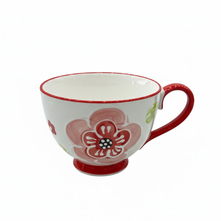 Ceramic mug with floral design on a white background