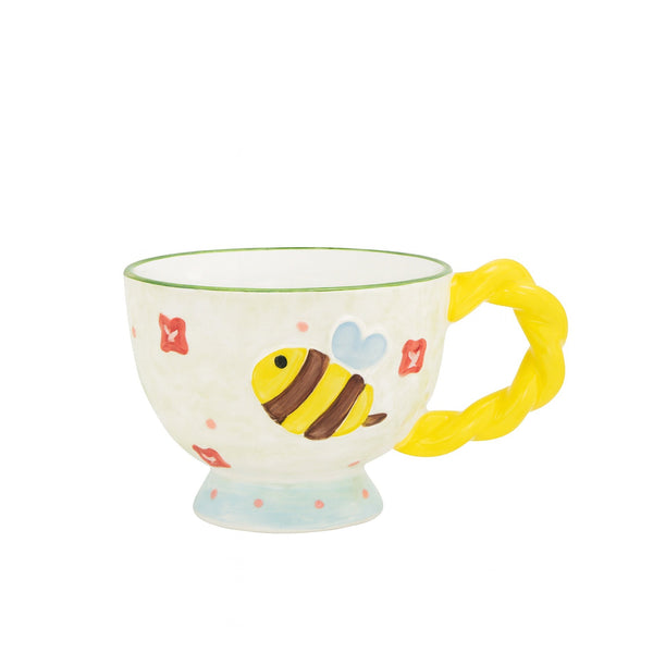 Children's mug with a bee design on a white background