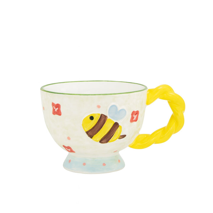 Children's mug with a bee design on a white background