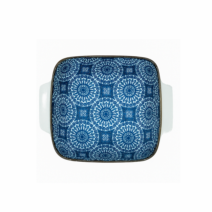 Square plate with blue geometric pattern on a white background