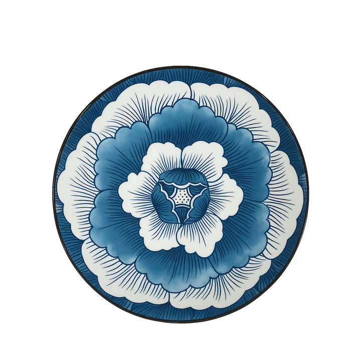 Decorative plate with blue and white floral design on a white background