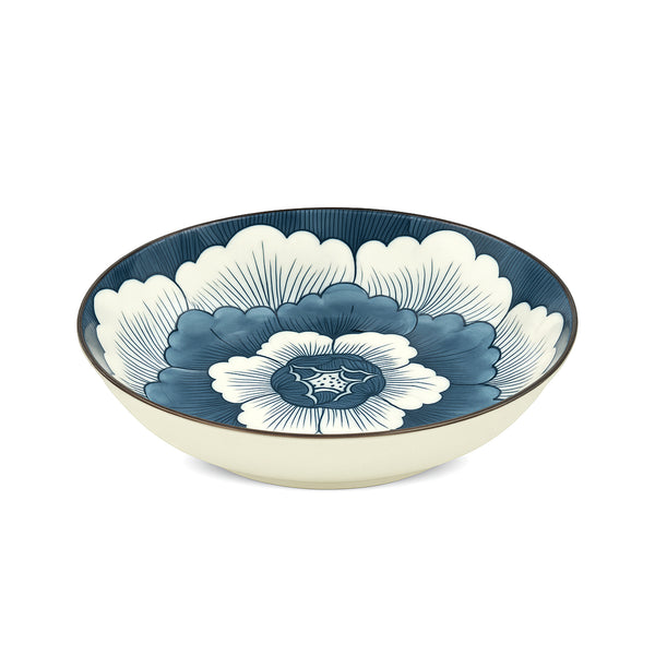 Ceramic bowl with blue and white floral design on a white background