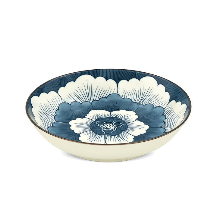 Ceramic bowl with blue and white floral design on a white background