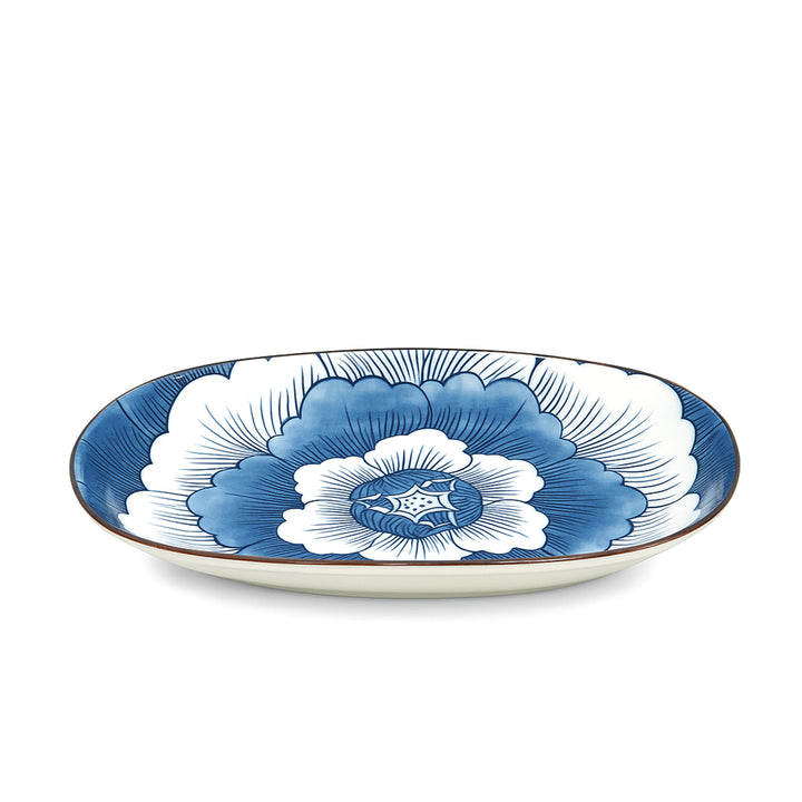 Decorative plate with blue and white floral design on a white background