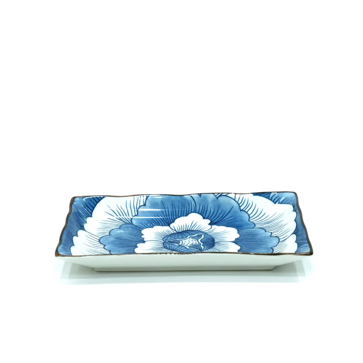 Rectangular ceramic dish with blue floral design on a white background