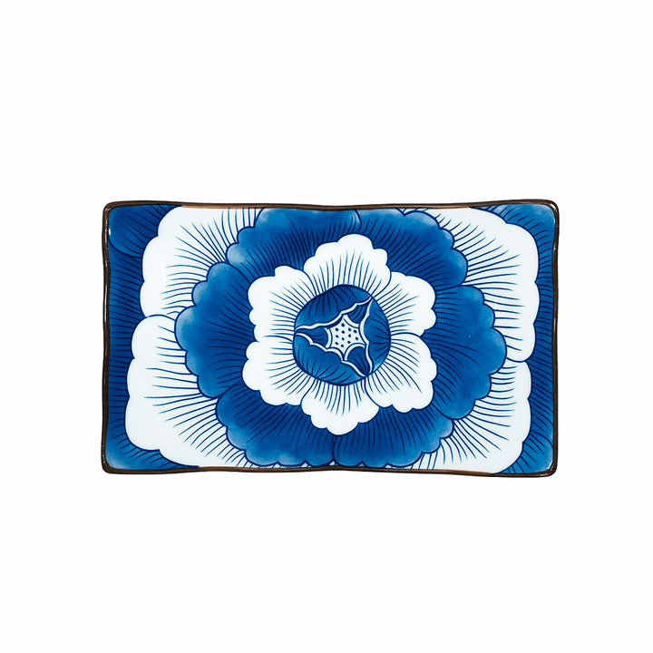 Rectangular plate with a blue and white floral design on a white background