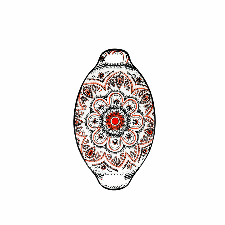 Decorative pendant with intricate patterns on a white background