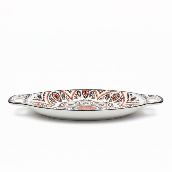 Decorative ceramic platter with paisley pattern on a white background