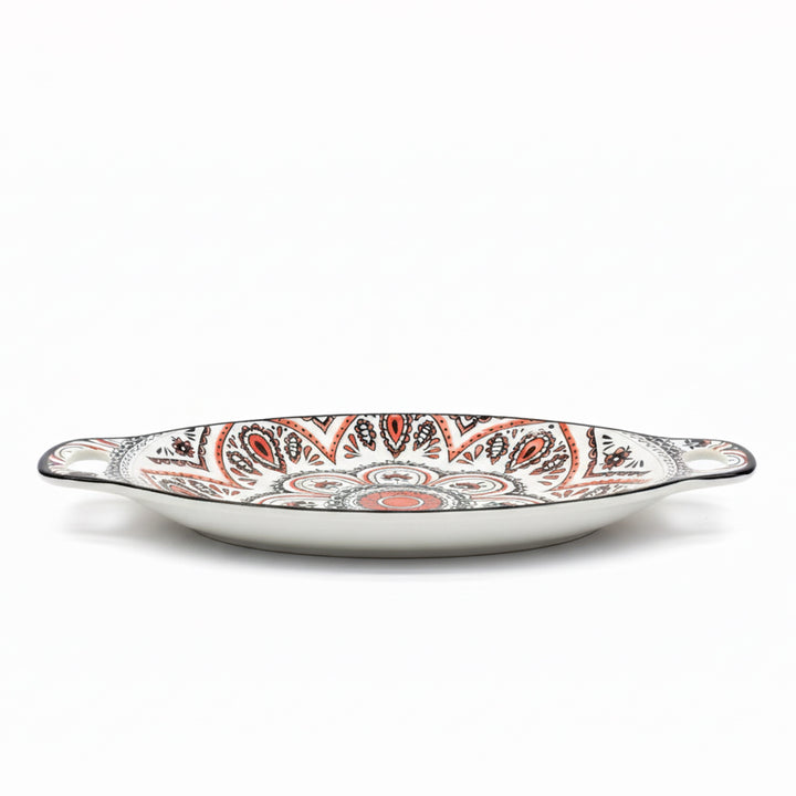 Decorative ceramic platter with paisley pattern on a white background