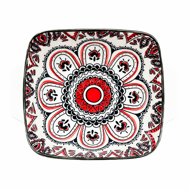 Decorative square plate with a red and black mandala design on a white background