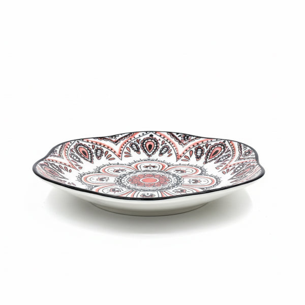 Decorative plate with a colorful paisley pattern on a white background