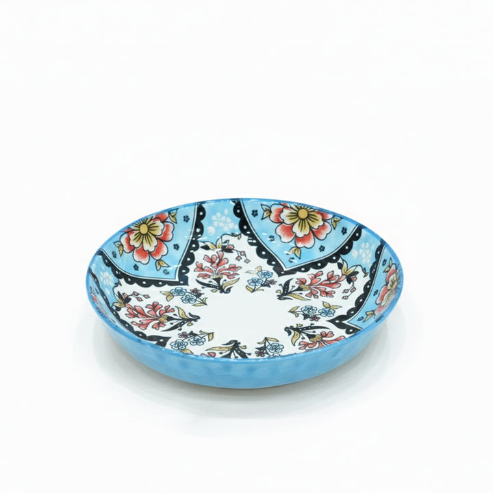 Decorative ceramic plate with floral patterns on a white background