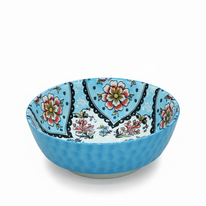 Blue bowl with floral pattern on a white background