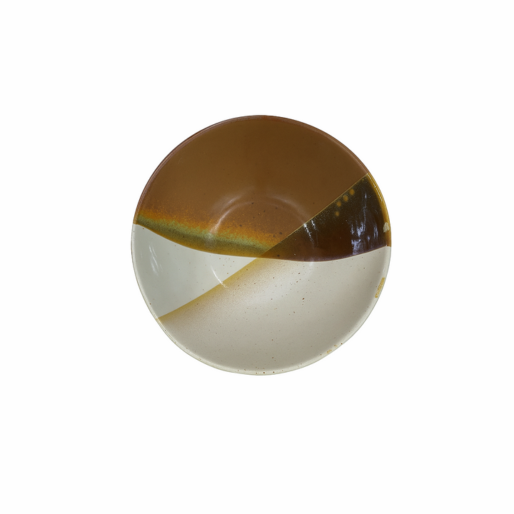 Round ceramic plate with brown and beige design on a white background