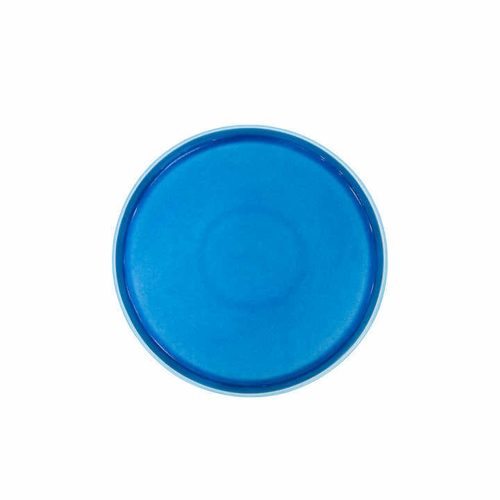Blue ceramic plate on a white background