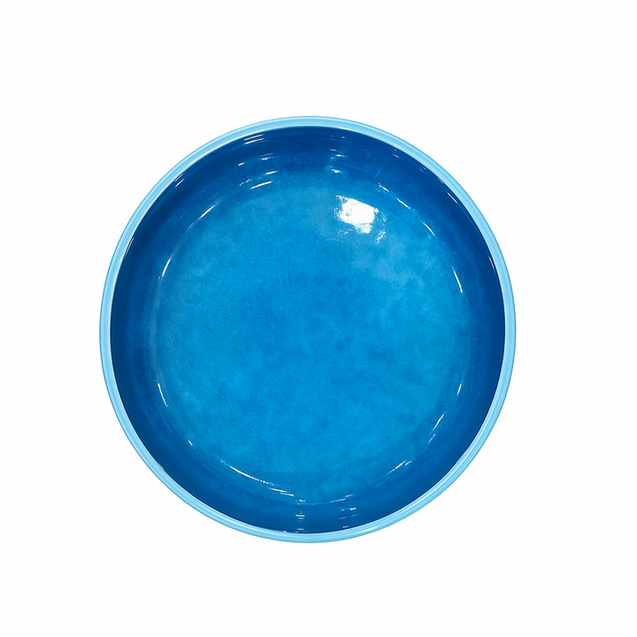 Blue ceramic bowl on a white background