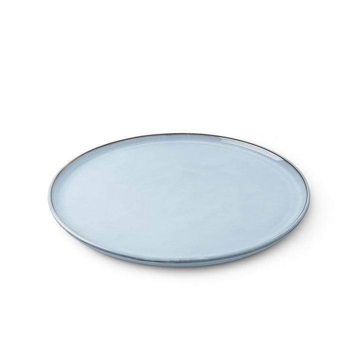 Light blue ceramic plate on a white background