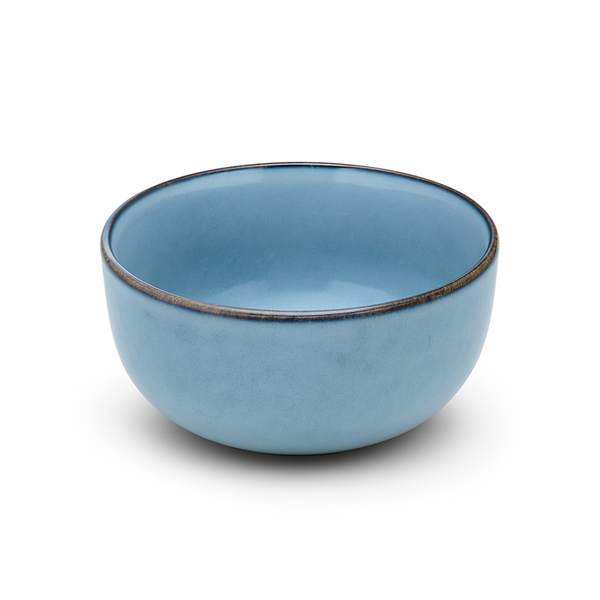 Steaming bowl of soup with chopsticks on a wooden table, kitchen in the background