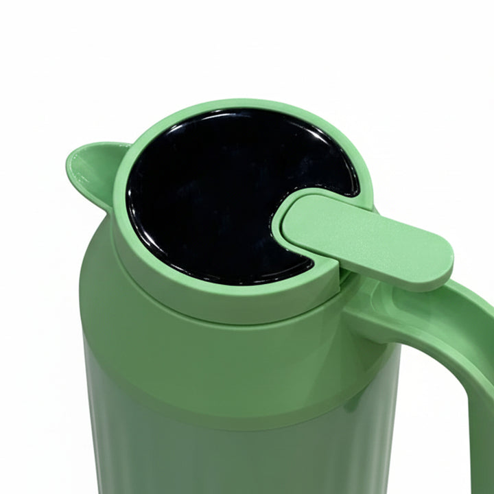 Green thermos with black interior on a white background